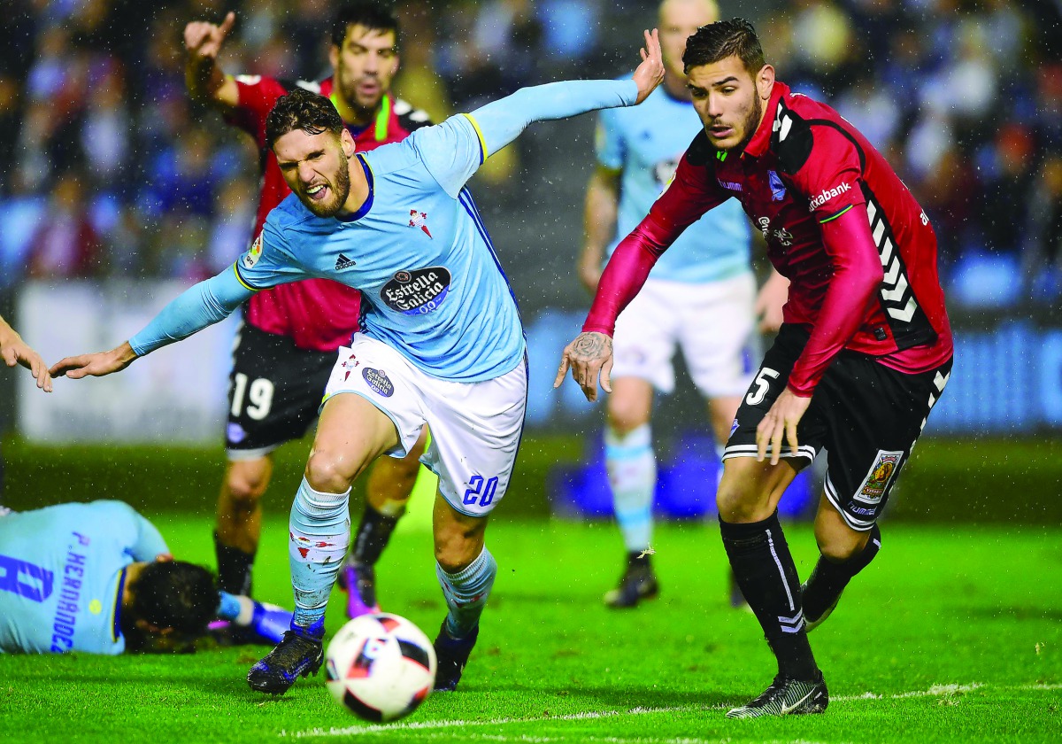 Celta Vigo's defender Sergi Gomez (left) vies with Alaves' French defender Theo Hernandez during the Spanish Copa del Rey semi-final first leg match at the Balaidos Stadium in Vigo on Thursday. Both the teams will have it all to play for in the second leg