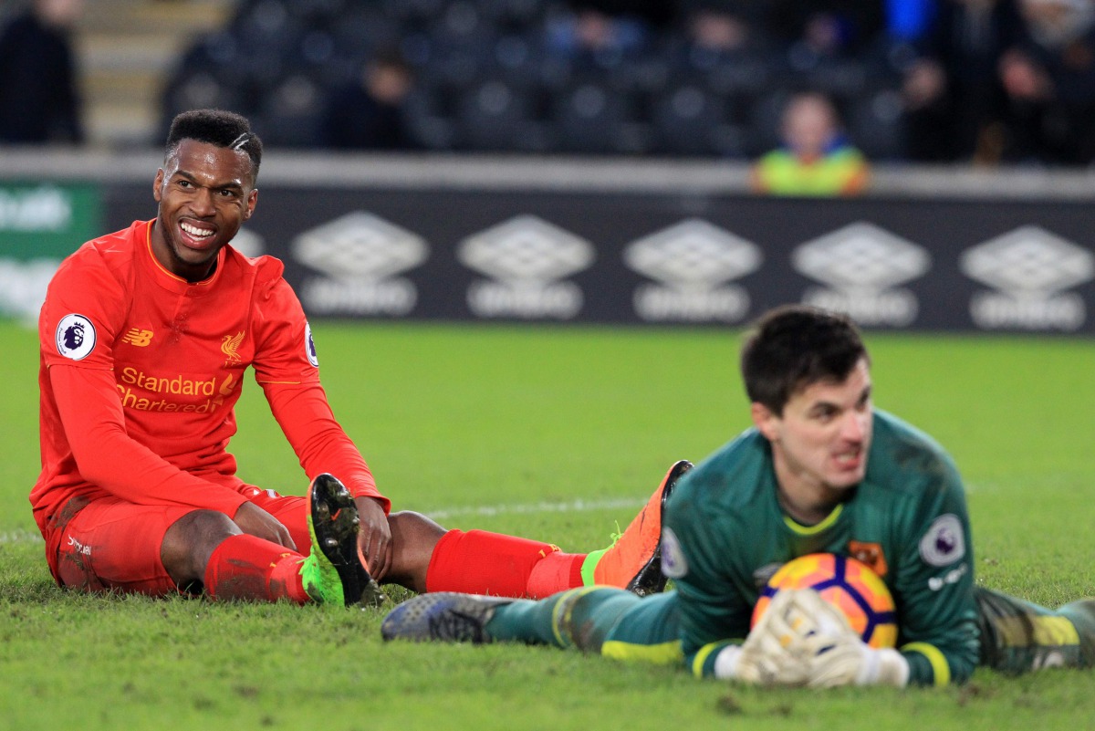 Liverpool's English striker Daniel Sturridge (L) reacts after missing a chance during the English Premier League football match between Hull City and Liverpool at the KCOM Stadium in Kingston upon Hull, north east England on February 4, 2017. Hull won the