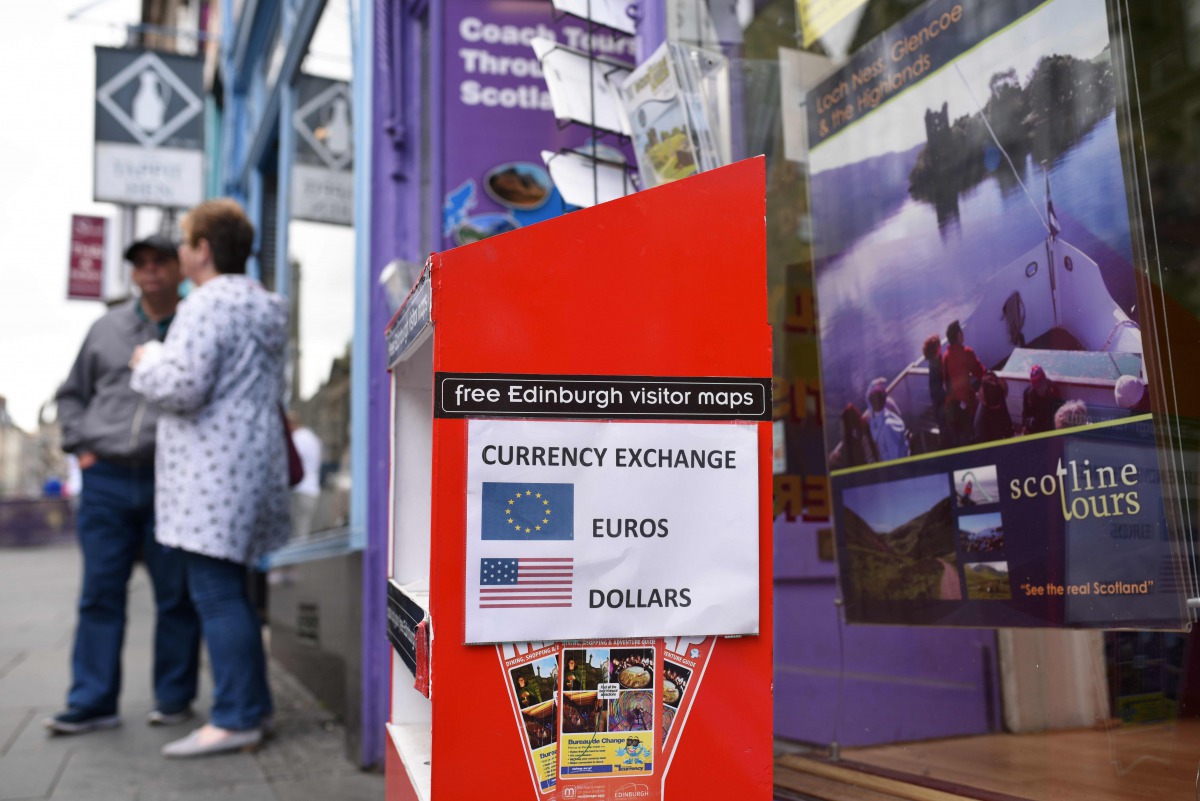 Representative image: A travel agent on the Royal Mile offers a currency exchange service in Edinburgh Scotland on June 25, 2016 (AFP)