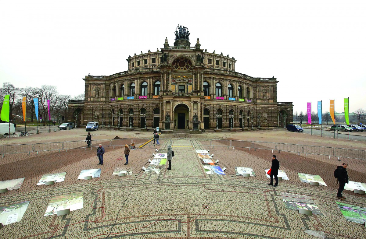 People look at a photo exhibition 