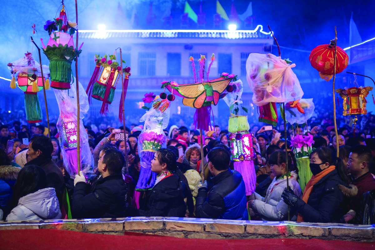 Chinese entertainers preparing for a local folk performance during the Lunar New Year celebration in a village in Longnan, northwest China's Gansu province
