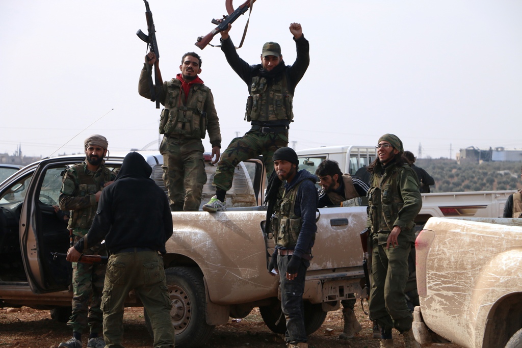 Members of Free Syrian Army are seen after taking control over strategic points of al-Bab town of Aleppo during the 169th day of the 