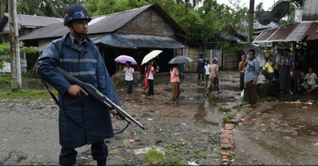An armed policeman guards a road at the Aung Mingalar displacement camp for Rohingya in Sittwe, in September 2016. (AFP/Romeo Gacad).