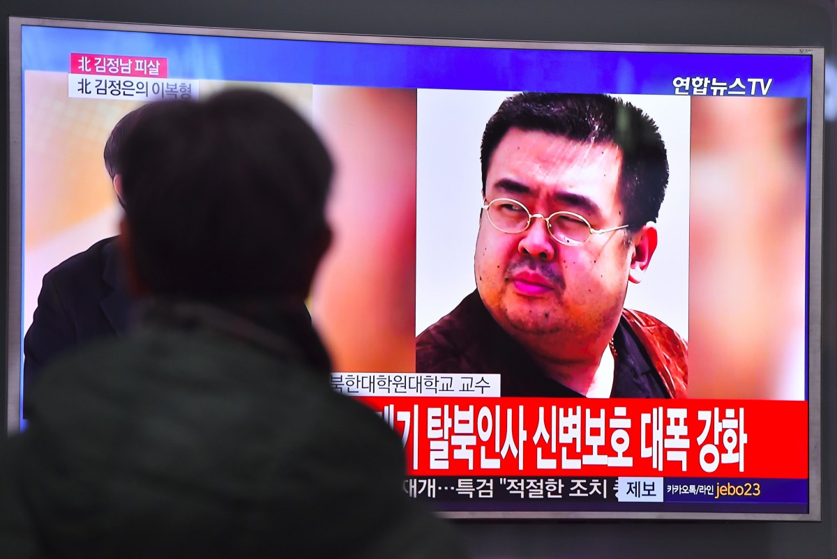 A man watches a television showing news reports of Kim Jong-Nam, the half-brother of North Korean leader Kim Jong-Un, in Seoul on February 14, 2017. Kim Jong-Nam, the half-brother of North Korean leader Kim Jong-Un has been assassinated in Malaysia, South