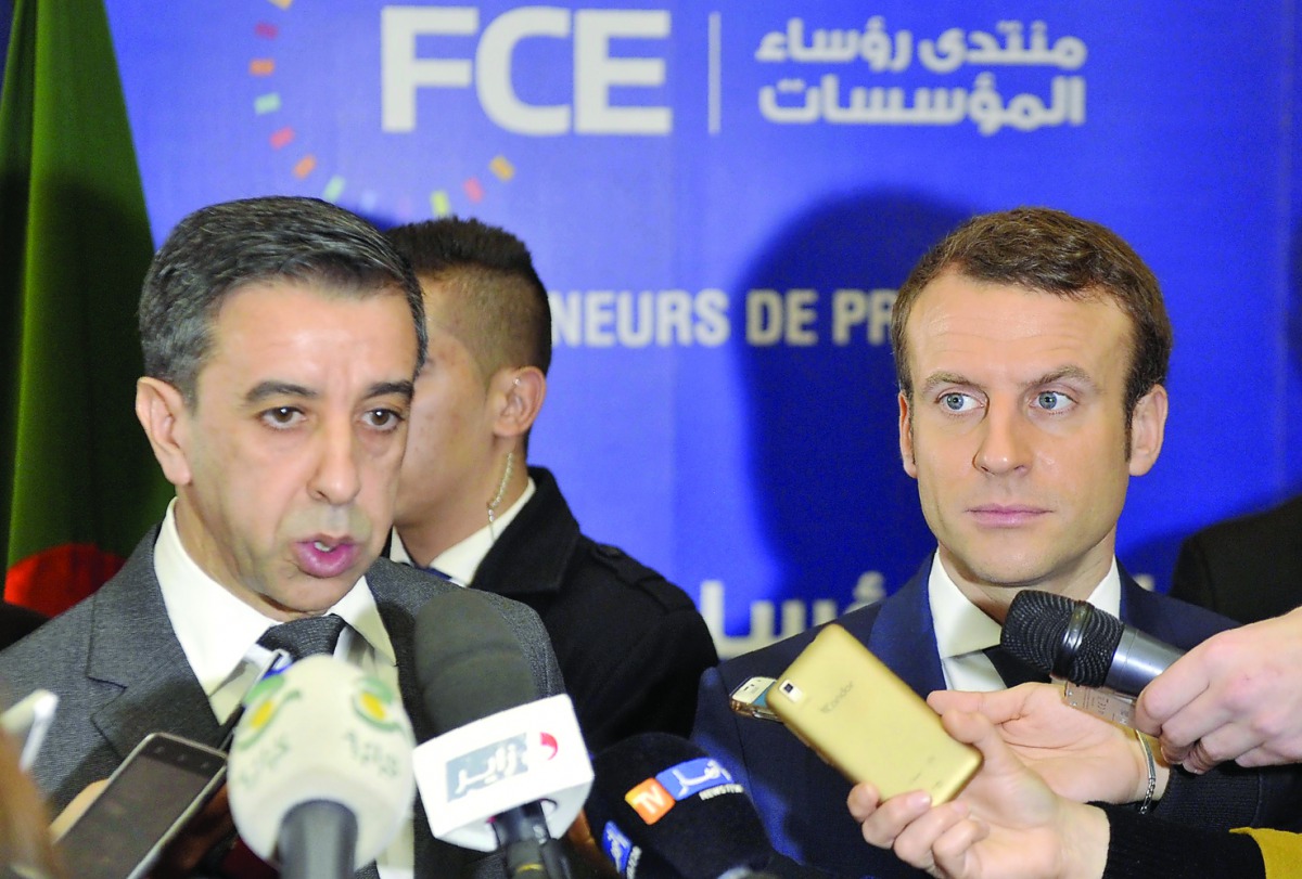 French presidential hopeful Emmanuel Macron (right) and Ali Haddad, head of the forum of business leaders (FCE) speak to the press after meeting with Algerian businessmen in Algiers yesterday. Macron declared that bilateral relations with Algeria, the for