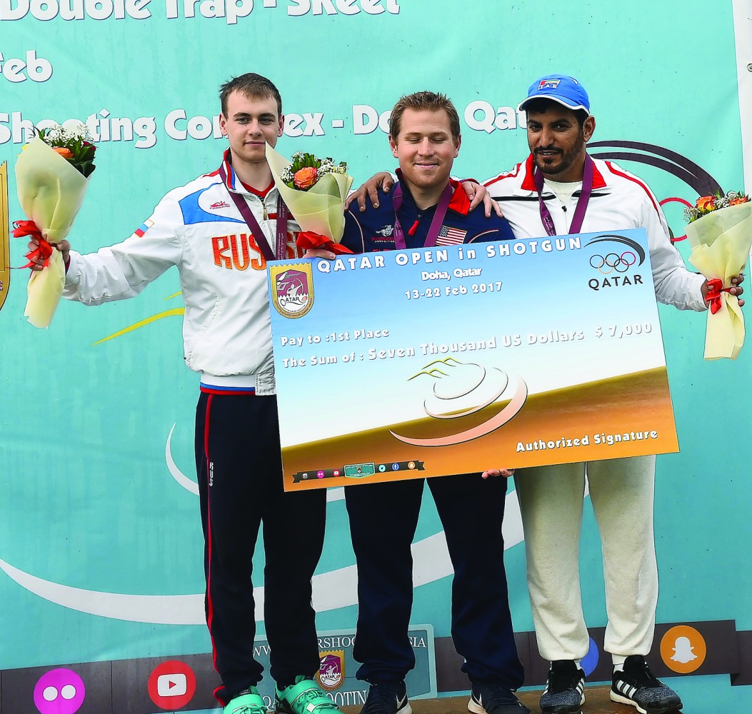Podium winners of the event, (from left) Nikita Egorov, Wallace and Hamad Alkendi pose for a photograph during an event after Qatar Open Shotgun championship at the Losail Shooting Range yesterday.   