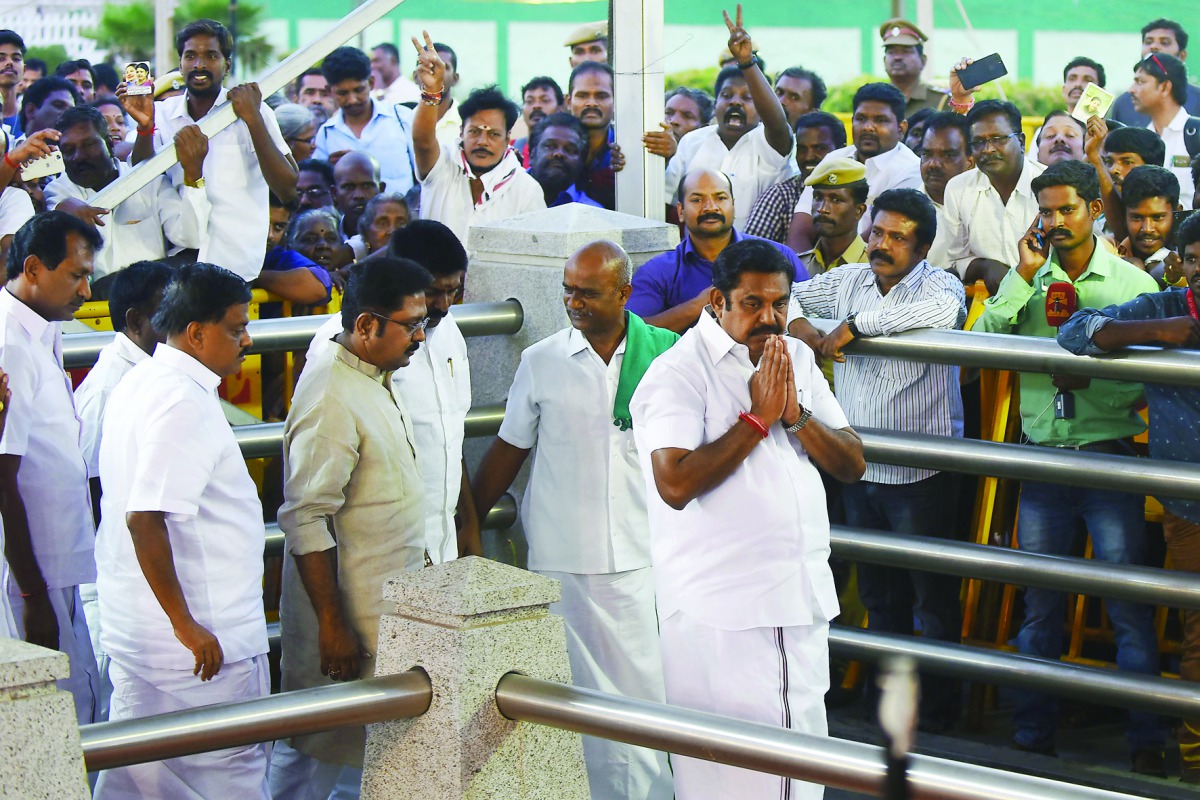 Tamil Nadu Chief Minister Edapadi Palaniswami (right) gestures as he pays his respects at the memorial for former state chief minister Jayalalithaa after being sworn in Chennai yesterday.