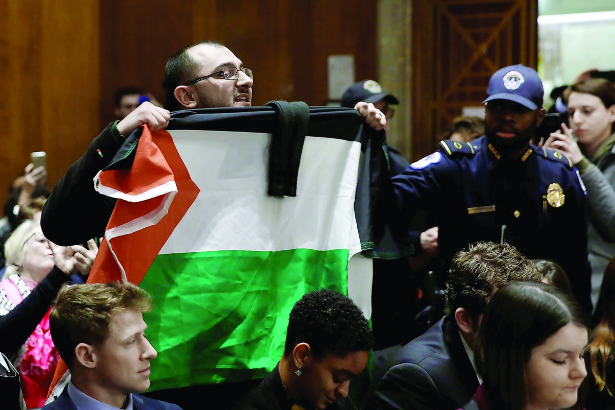 A supporter of Palestinian rights disrupts the confirmation hearing of David Friedman, US President Donald Trump's nominee to be the next US ambassador to Israel, as Friedman testifies before the Senate Foreign Relations Committee in Washington, yesterday
