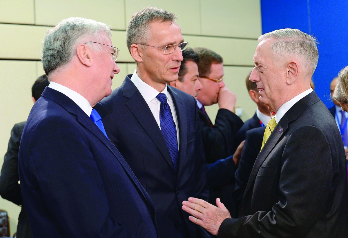 US Secretary of Defence James Mattis (right) speaks with Nato Secretary General Jens Stoltenberg (centre) next to British Defence Secretary Michael Fallon before the Nato Defence Ministers’ meeting in Brussels, yesterday.