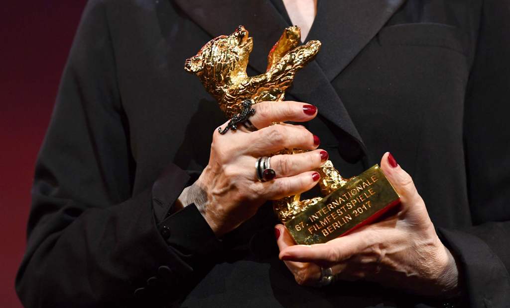 Costume designer Milena Canonero accepts an Honorary Golden Bear for her lifetime achievement at the 67th Berlinale International Film Festival in Berlin, February 16, 2017. REUTERS/Jens Kalaene/POOL
