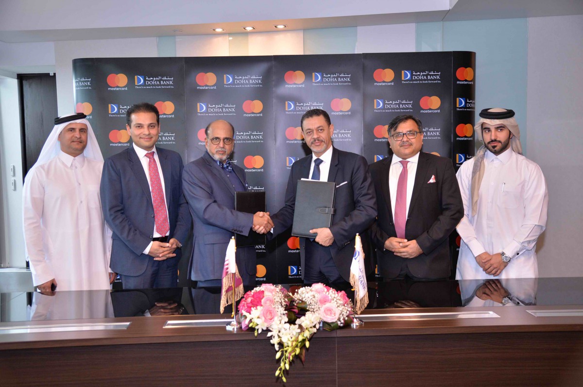 Dr R Seetharaman (third left), Group CEO of Doha Bank; and other senior officials from Doha Bank and Mastercard at the signing ceremony.