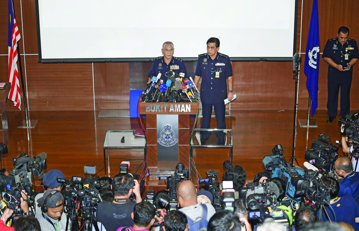 Royal Malaysian Police Deputy Inspector-General Noor Rashid Ibrahim speaks during a press conference as Selangor State Police Chief Abdul Samah Mat (right) looks on at the Bukit Aman national police headquarters in Kuala Lumpur yesterday.