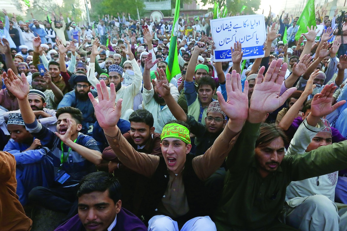 Supporters of the religious party Jamat Ehl-e-Sunnat chant slogans to condemn Thursday’s suicide blast at the tomb of Sufi saint Syed Usman Marwandi, also known as the Lal Shahbaz Qalandar shrine, during a protest rally near the Sindh Assembly Building in