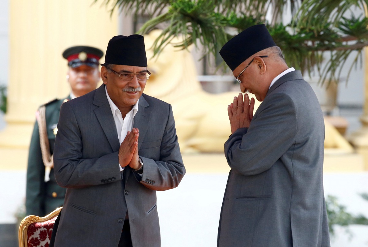  Newly elected Nepalese Prime Minister Pushpa Kamal Dahal, also known as Prachanda, (L) greets outgoing Prime Minister Khadga Prasad Sharma Oli (R) upon their arrival during the administers of oath of office to the newly-elected Prime Minister at the pres