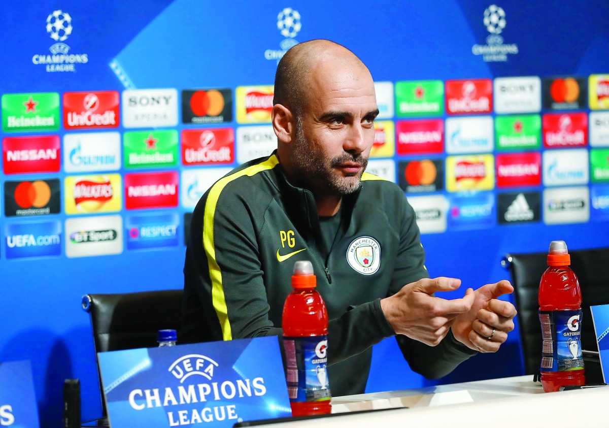 Manchester City's Spanish manager Pep Guardiola addresses the media during a press conference at the City Football Academy in Manchester, northern England, on the eve of their UEFA Champions League Round of 16 first-leg match against Monaco.