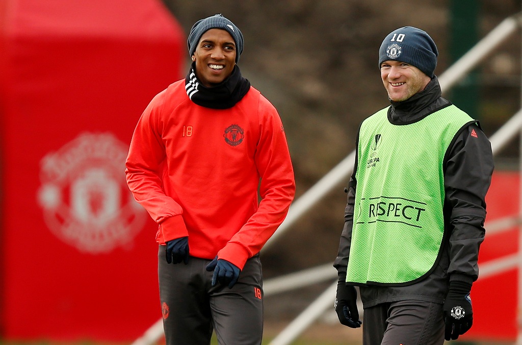 Manchester United's Ashley Young and Wayne Rooney during training. Reuters / Andrew Yates