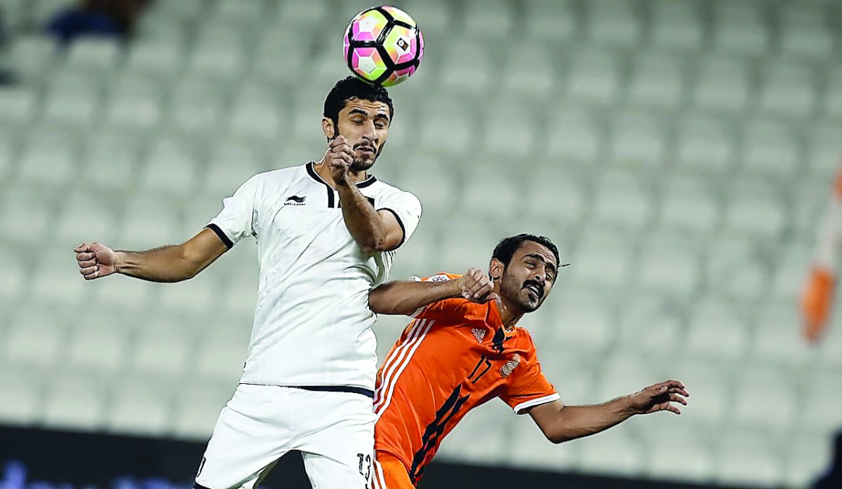 Al Sadd defender Ibrahim Majid (left) heads the ball during a Qatar Stars League match in this file photo.