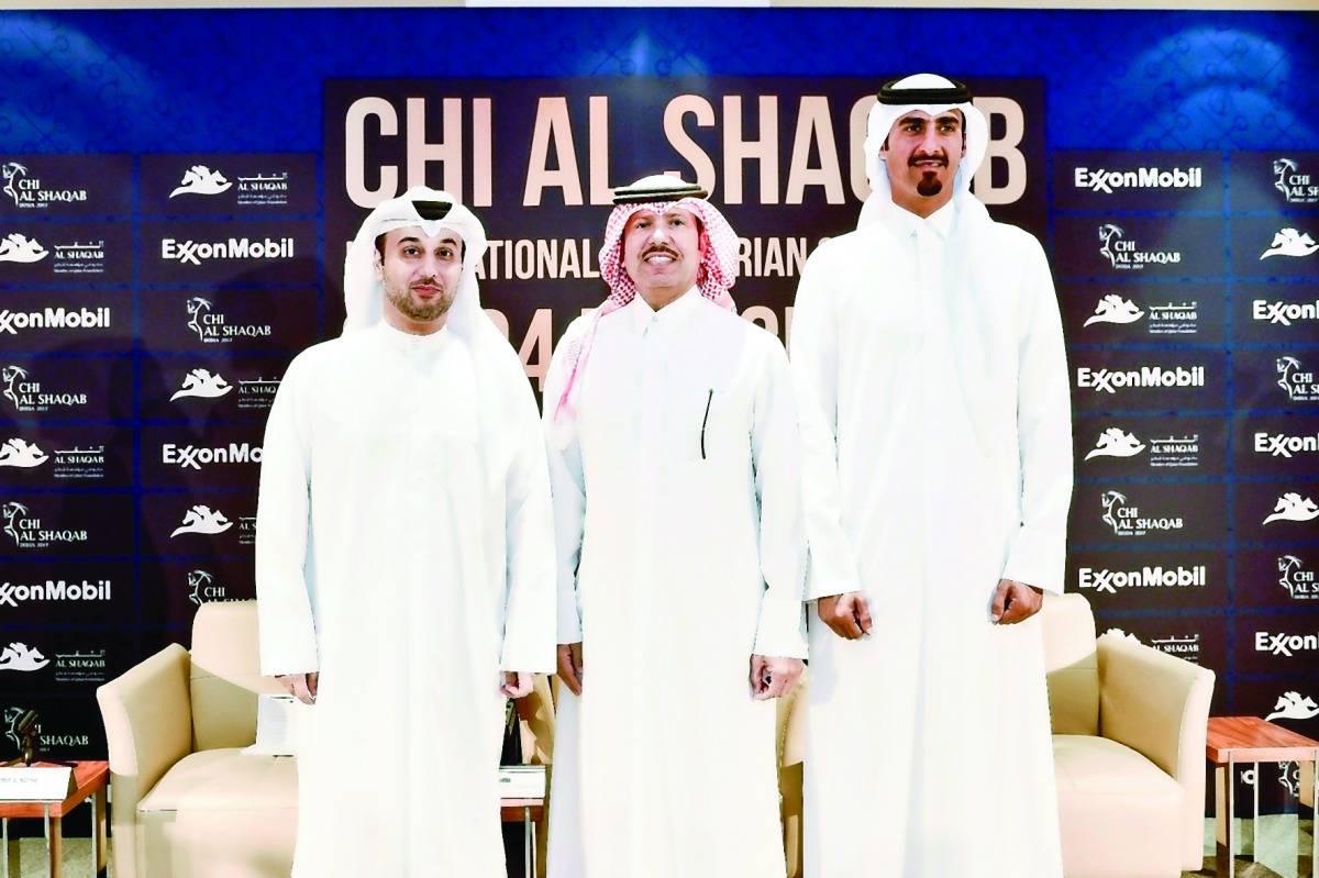 Omar Al Mannai, Event Director of CHI Al Shaqab, Saleh Al Mana, Vice President, Government and Public Affairs, ExxonMobil Qatar and Qatar's top rider Sheikh Ali bin Khalid Al Thani pose for a photograph following a press conference held at Al Shaqab yeste
