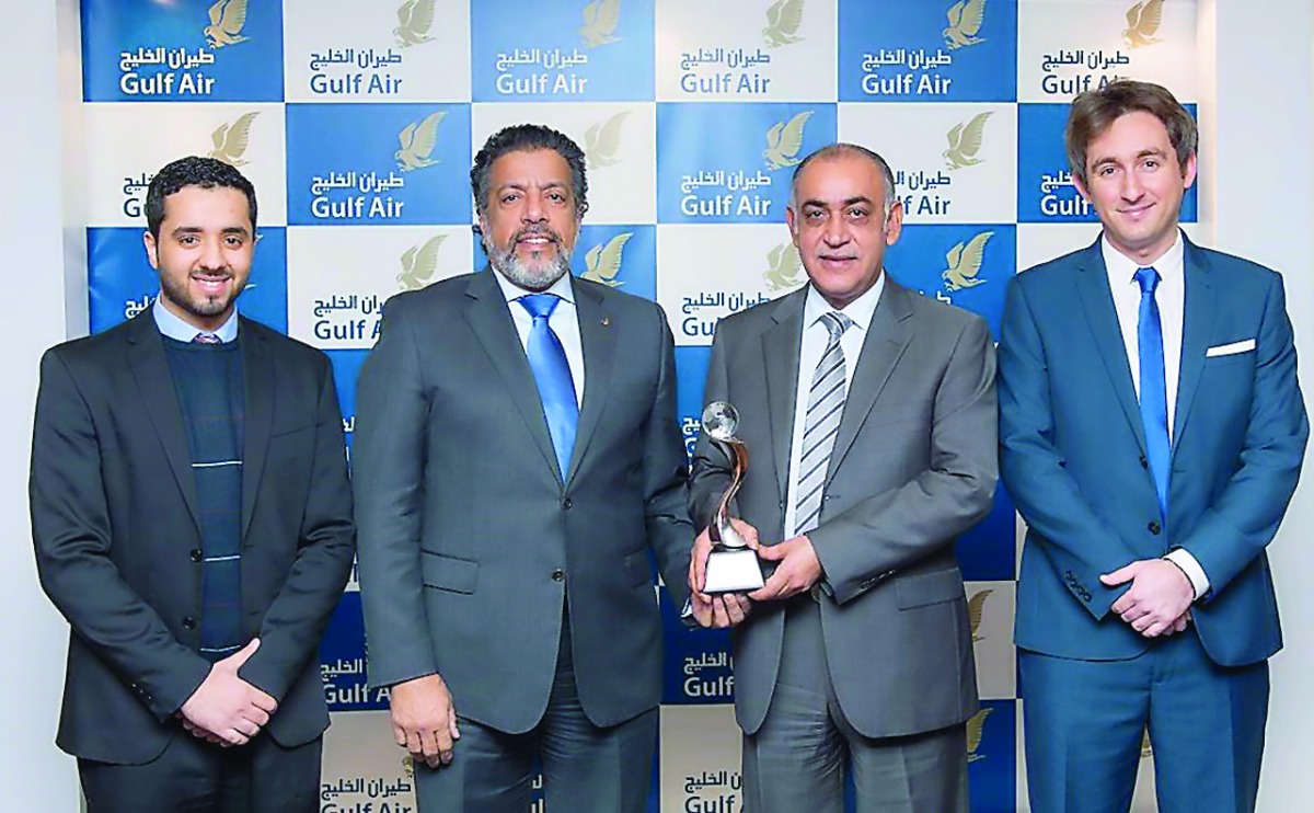 Gulf Air officials with the award. 
