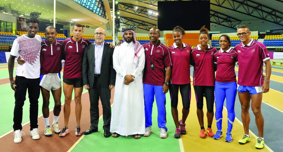 Mohammed Al Fadalah (centre) Director of Public Relations and Media Department at Qatar Olympic Committee and Dr Hazem Fareed, (fourth left) Deputy Sports Director at Aspire Academy, pose for a photograph with members of the Brazilian athletes during the 