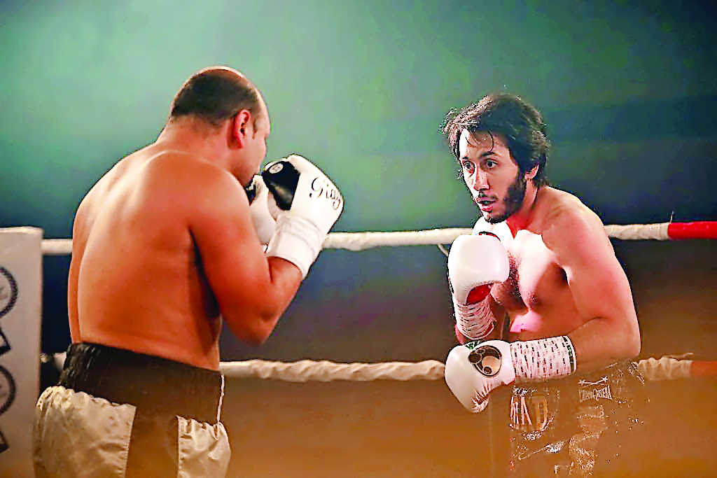Qatari boxer Sheikh Fahad Al Thani (right) in action during a charity bout held at the Margarita Ramos Pavilion in Leon, Spain recently. Qatar's first ever professional boxer fought against current WBA super-lightweight champion from Scotland Ricky Burns 