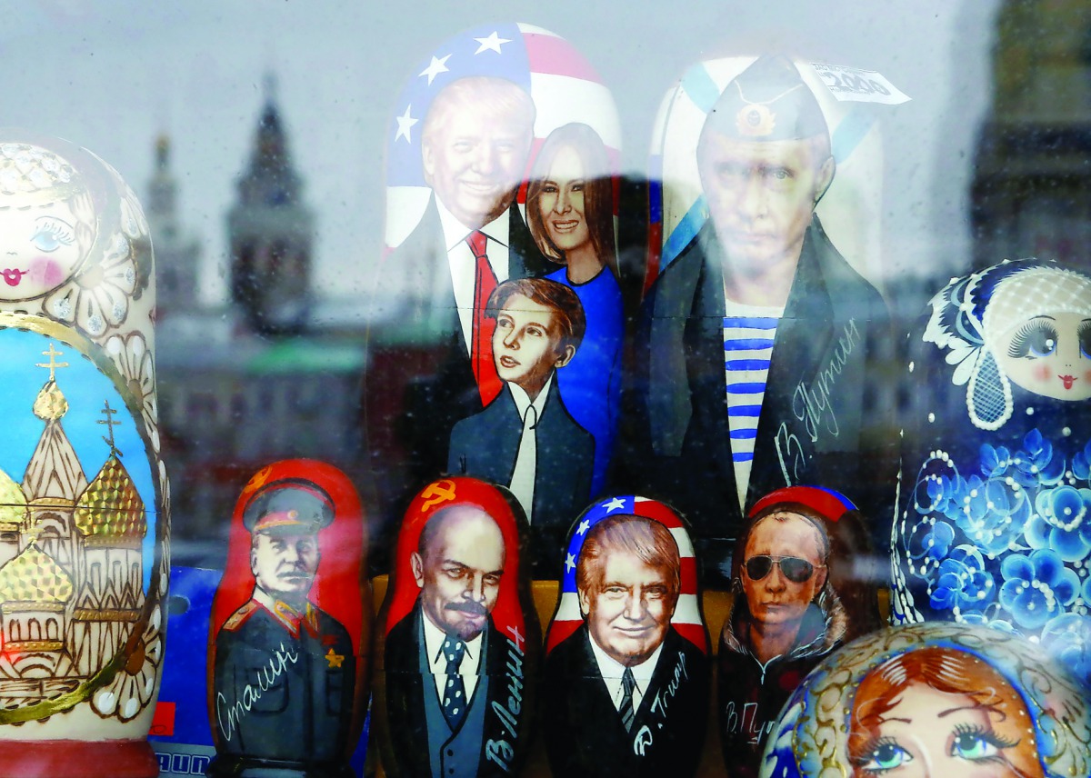 Russian traditional Matryoshka wooden dolls with images of Russian President Vladimir Putin, U.S. President Donald Trump together with family members, Soviet leaders Vladimir Lenin and Joseph Stalin are on sale at a gift kiosk in a street in Moscow, Russi