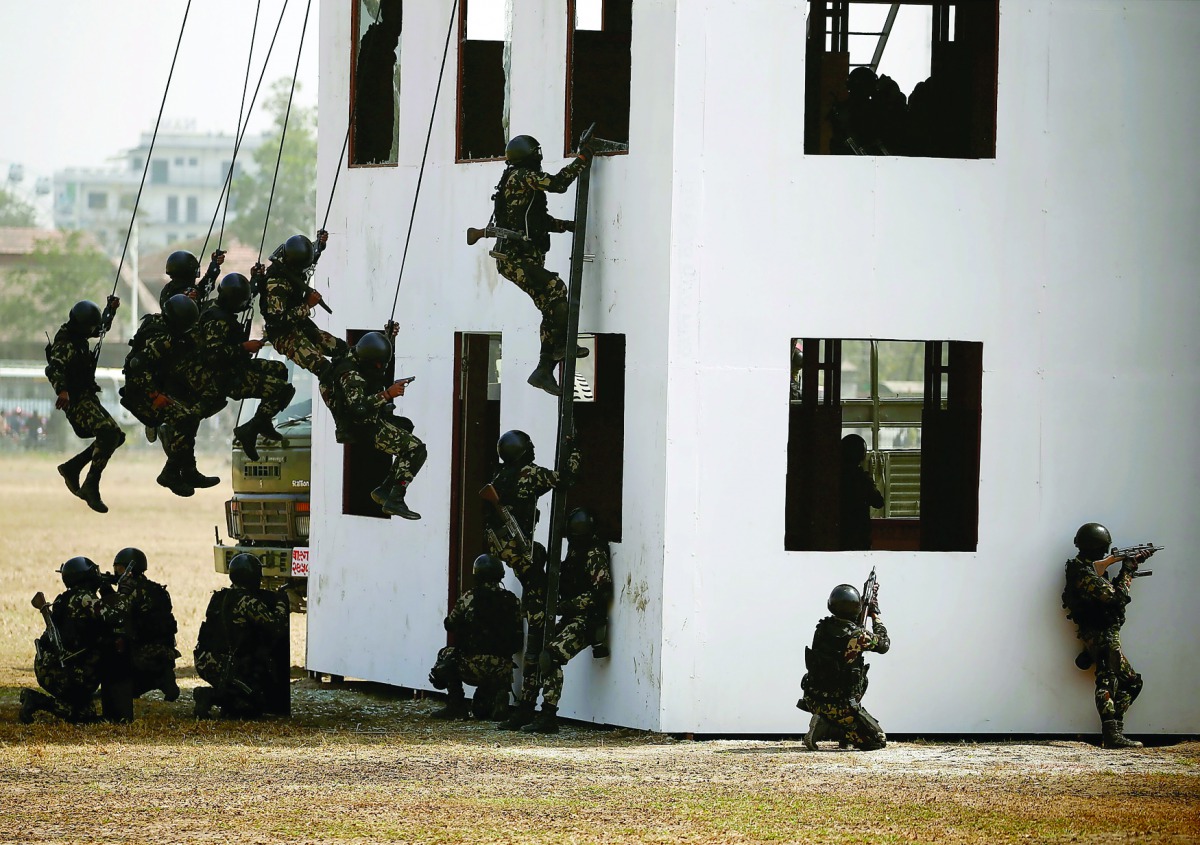 Members of Nepalese army demonstrate their rescue skills during the rehearsal for the upcoming Army Day celebration at Tundhikhel in Kathmandu, Nepal February 22, 2017. REUTERS/Navesh Chitrakar