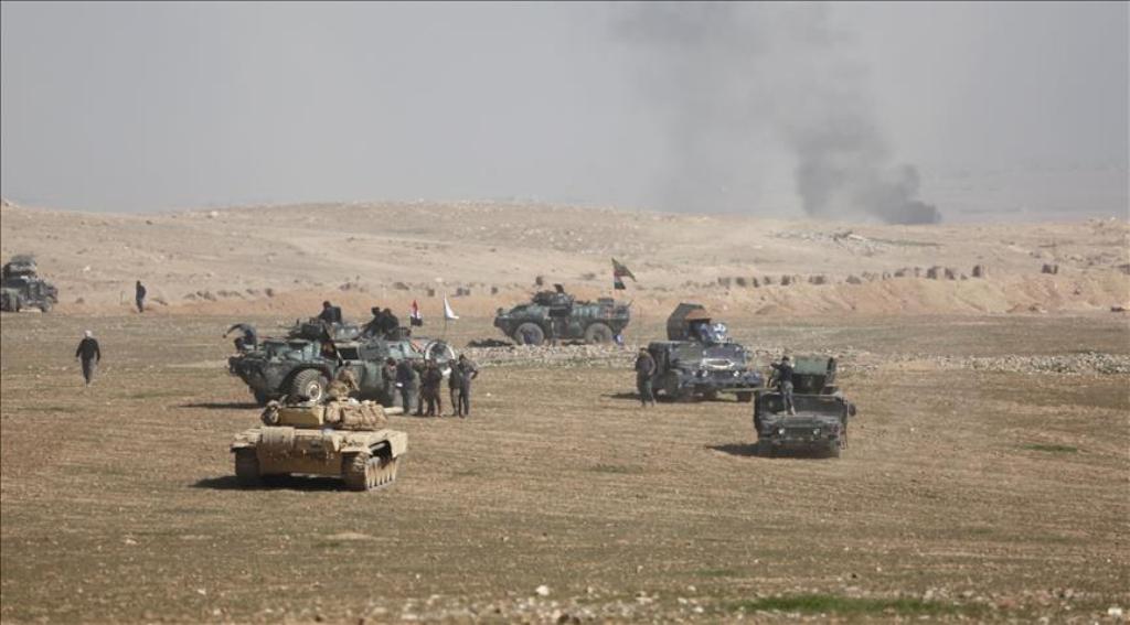 Iraqi security forces are seen on military vehicles as they advance towards Mosul International Airport Soldiers during an operation carried out to retake western part of Mosul from Daesh in Mosul, Iraq on February 20, 2017. ( Yunus Kele? - Anadolu Agency
