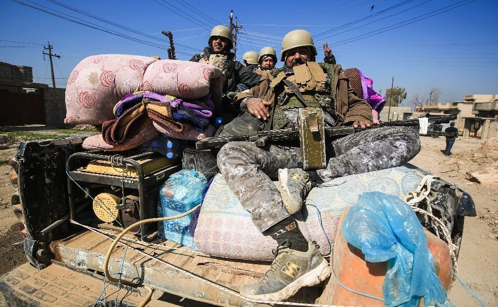 Iraqi security forces moved in convoys towards the disused airport, which lies on the southern approach to Mosul and is still held by the Islamic State group (AFP Photo/AHMAD AL-RUBAYE).