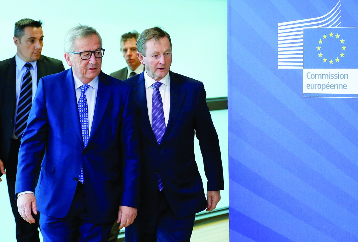 European Commission President Jean-Claude Juncker (left) welcomes Irish Prime Minister Enda Kenny ahead of a meeting at the EU Commission headquarters in Brussels, yesterday.