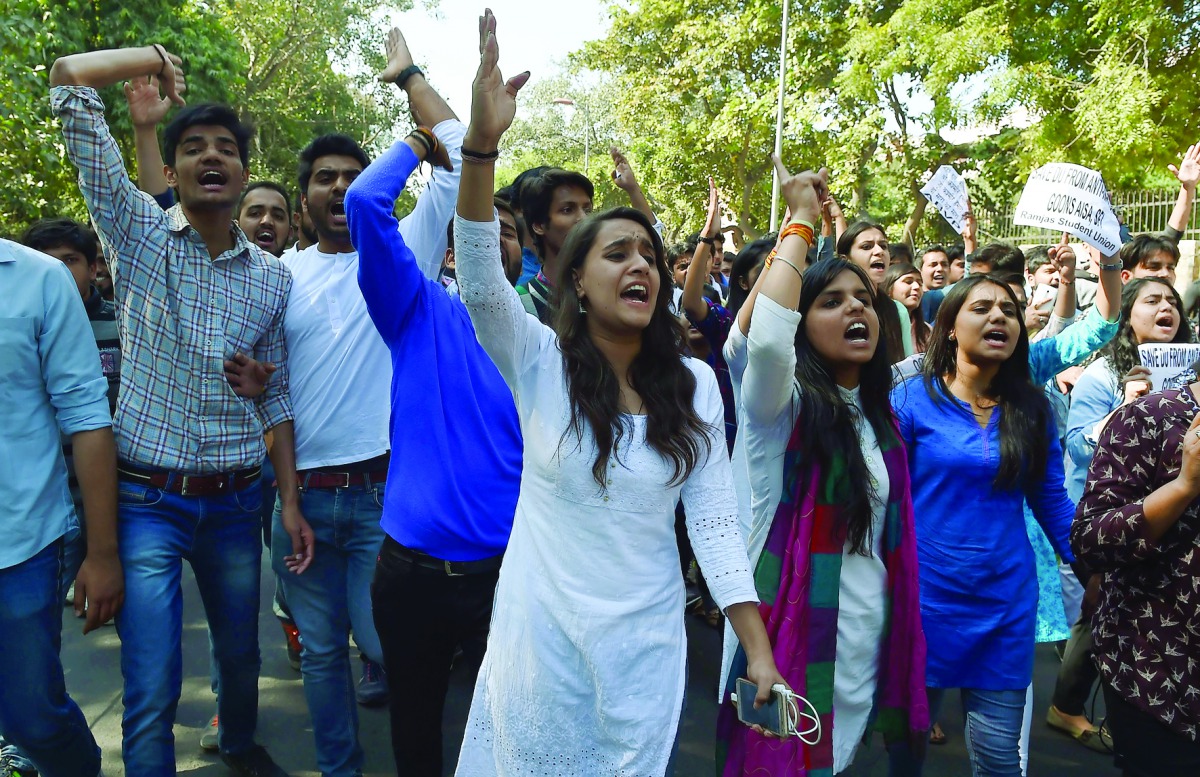 Members of India's right-wing student group ABVP shout slogans during a protest march at the Delhi University yesterday. Violent clashes between ABVP and left-leaning All India Students Association broke out at a Delhi University college over a seminar in