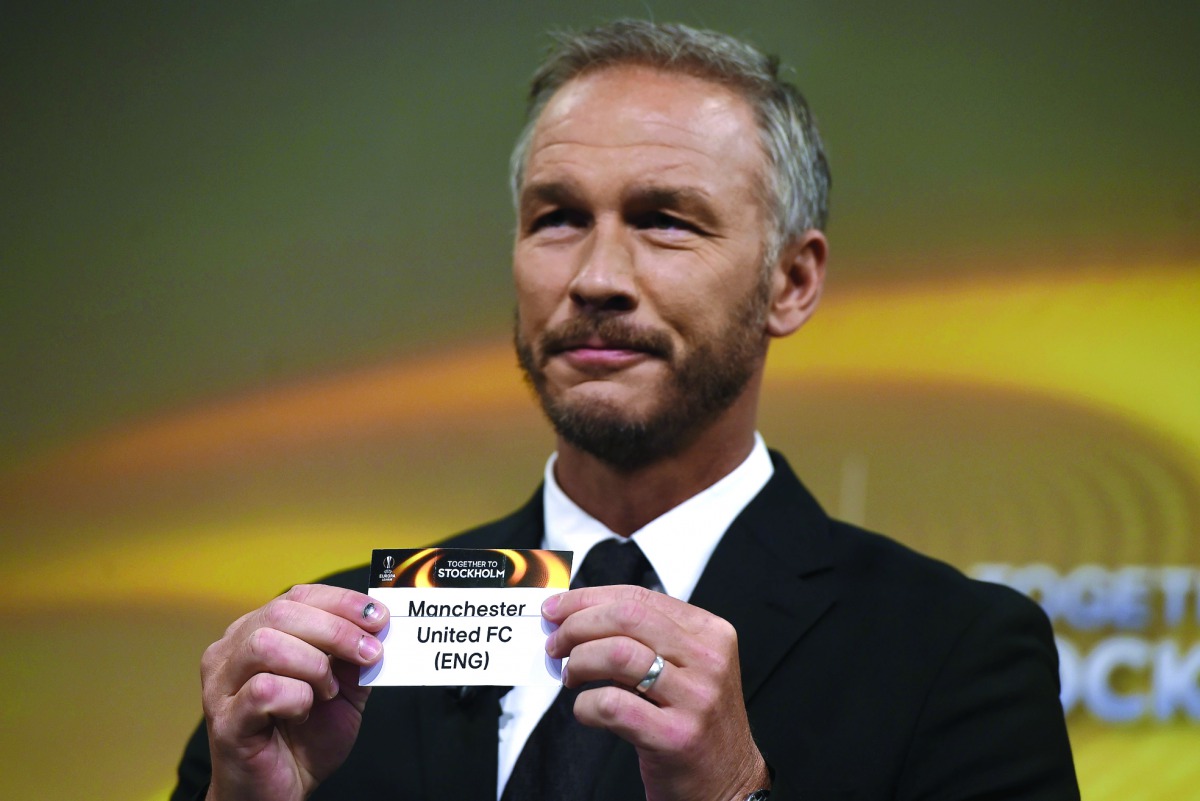 Sweden's former defender and 2017 Europa League final ambassador Patrik Andersson shows the name of Manchester United during the draw for the round of 16 of the UEFA Europa League tournament in Nyon, yesterday.