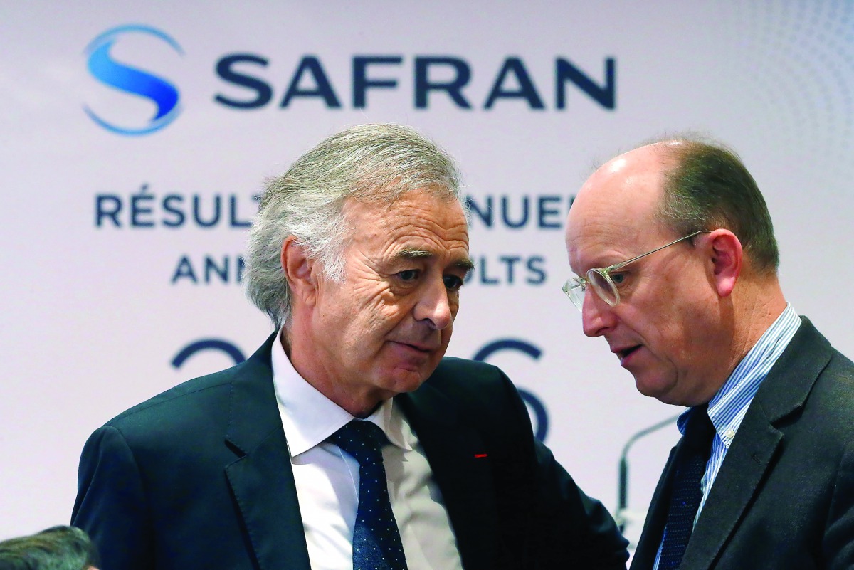 Safran Chief Executive Philippe Petitcolin (L) speaks with Bernard Delpit, Chief Financial Officer, before the company's 2016 annual results presentation in Paris, France, February 24, 2017. REUTERS/Charles Platiau
