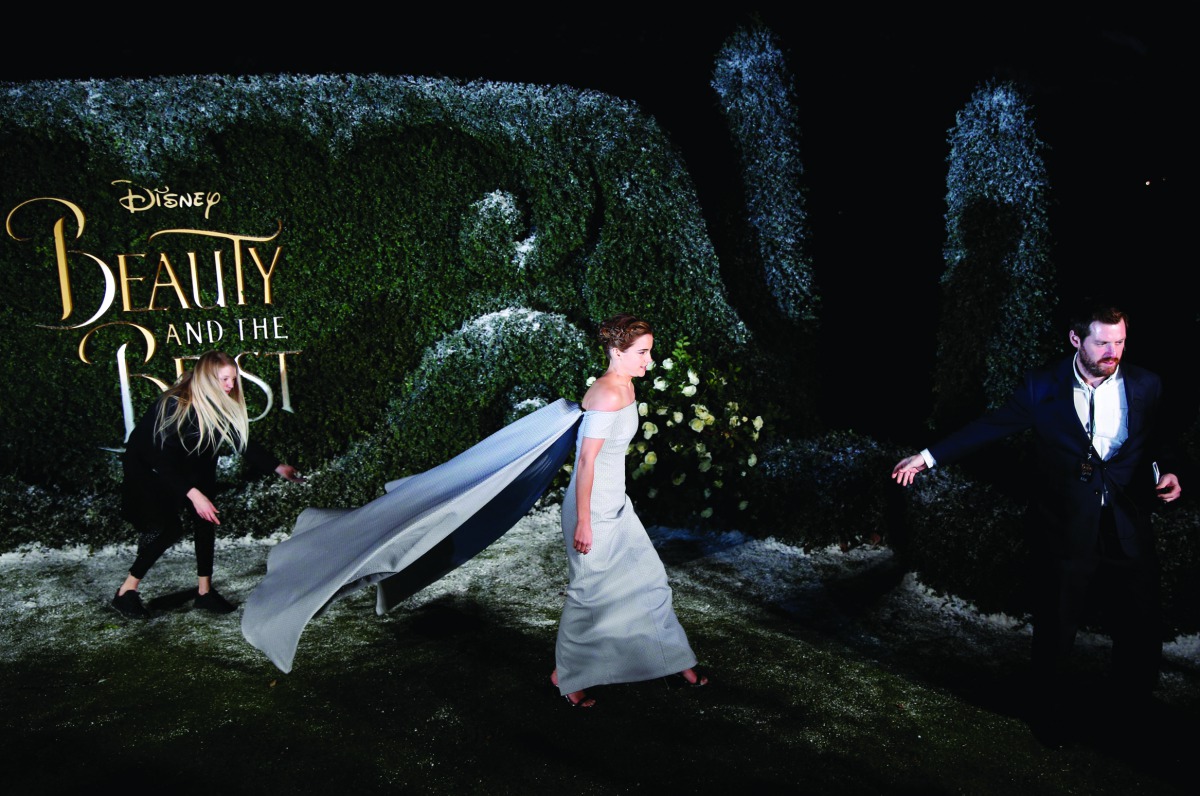 Actor Emma Watson leaves after posing for photographers at a media event for the film 