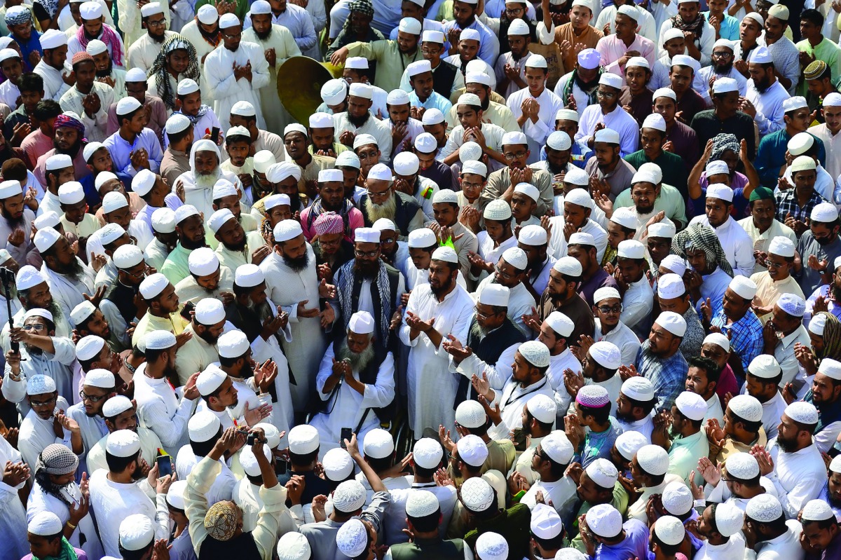 Activists from the Bangladesh Islamist group offer prayers as they take part in a protest in Dhaka yesterday calling for statue of a Greek goddess installed at the Supreme Court to be removed.
