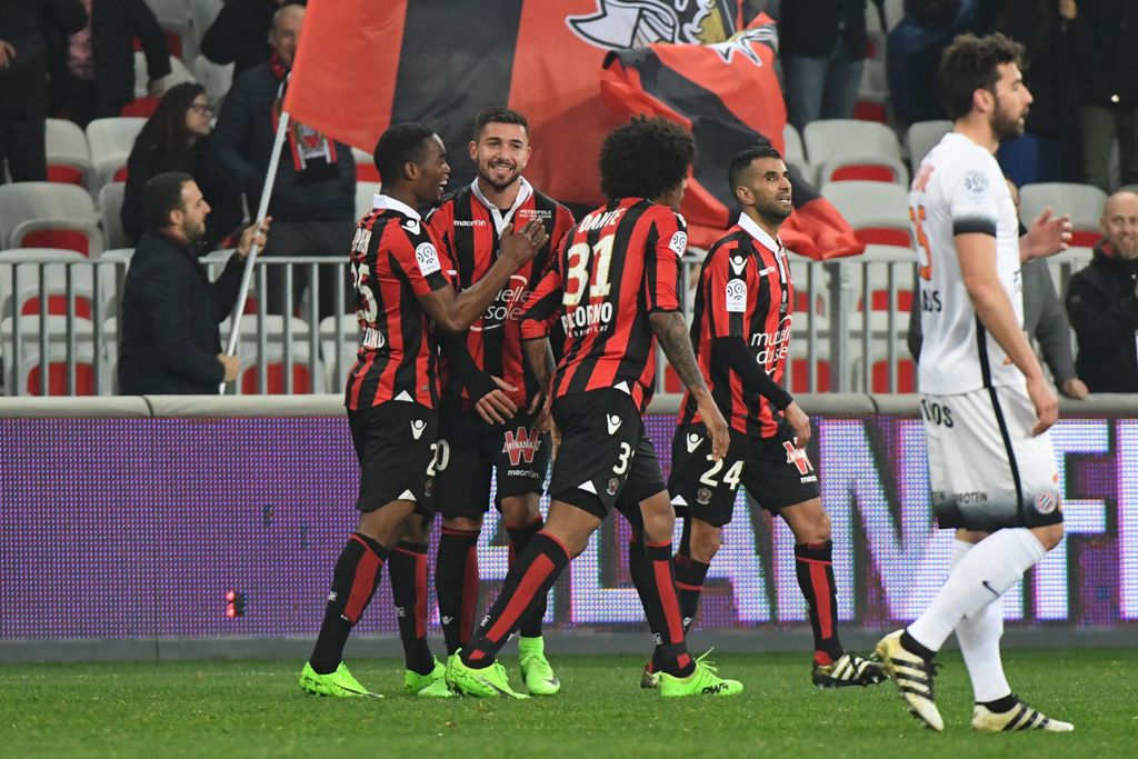 Nice's French forward Mickael Le Bihan (2ndL) celebrates with teammates after scoring his team's second goal during the French L1 football match OGC Nice vs Montpellier HSC at the Allianz Riviera Stadium in Nice on February 24 ,2017 / AFP / Yann COATSALIO