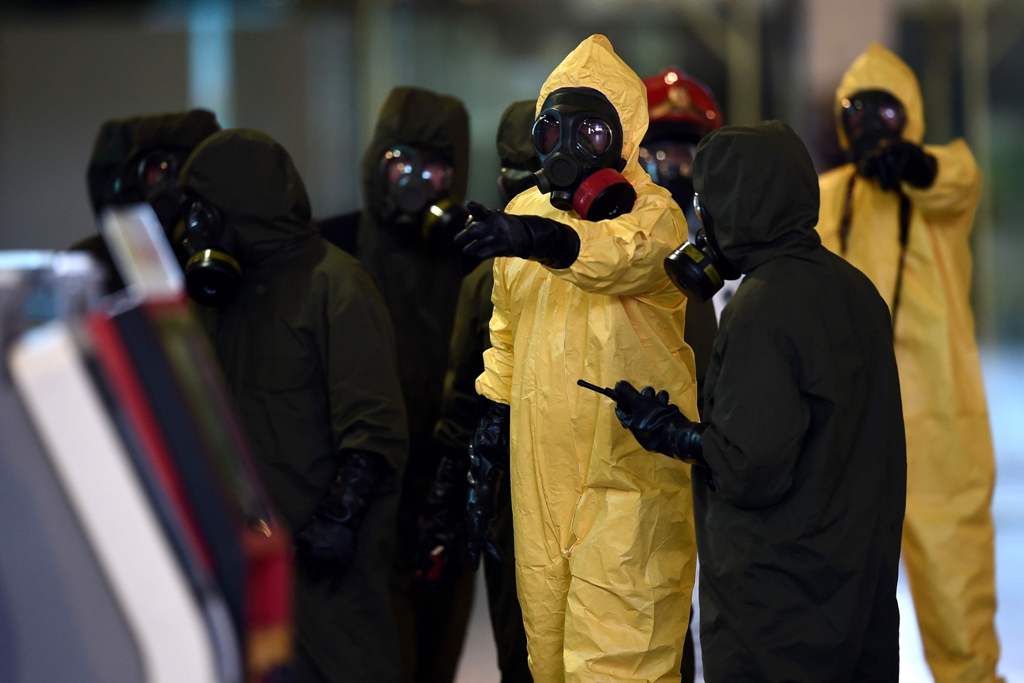 Members of Malaysia's Hazmat team conduct a decontamination operation at the departures terminal of the Kuala Lumpur International Airport 2 (KLIA 2) in Sepang on February 26, 2017. AFP / MANAN VATSYAYANA
