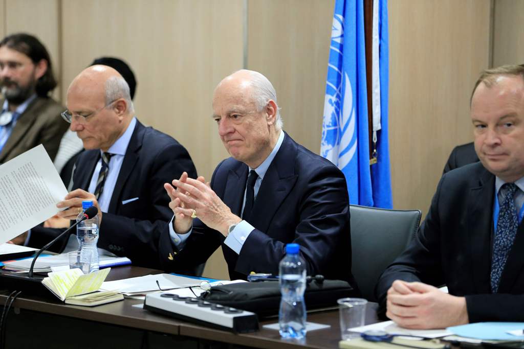 UN Special Envoy for Syria Staffan de Mistura (C) attends a meeting of Intra-Syria peace talks with Syrian government delegation at the Palais des Nations in Geneva on February 25, 2017.   AFP / POOL / Pierre ALBOUY

