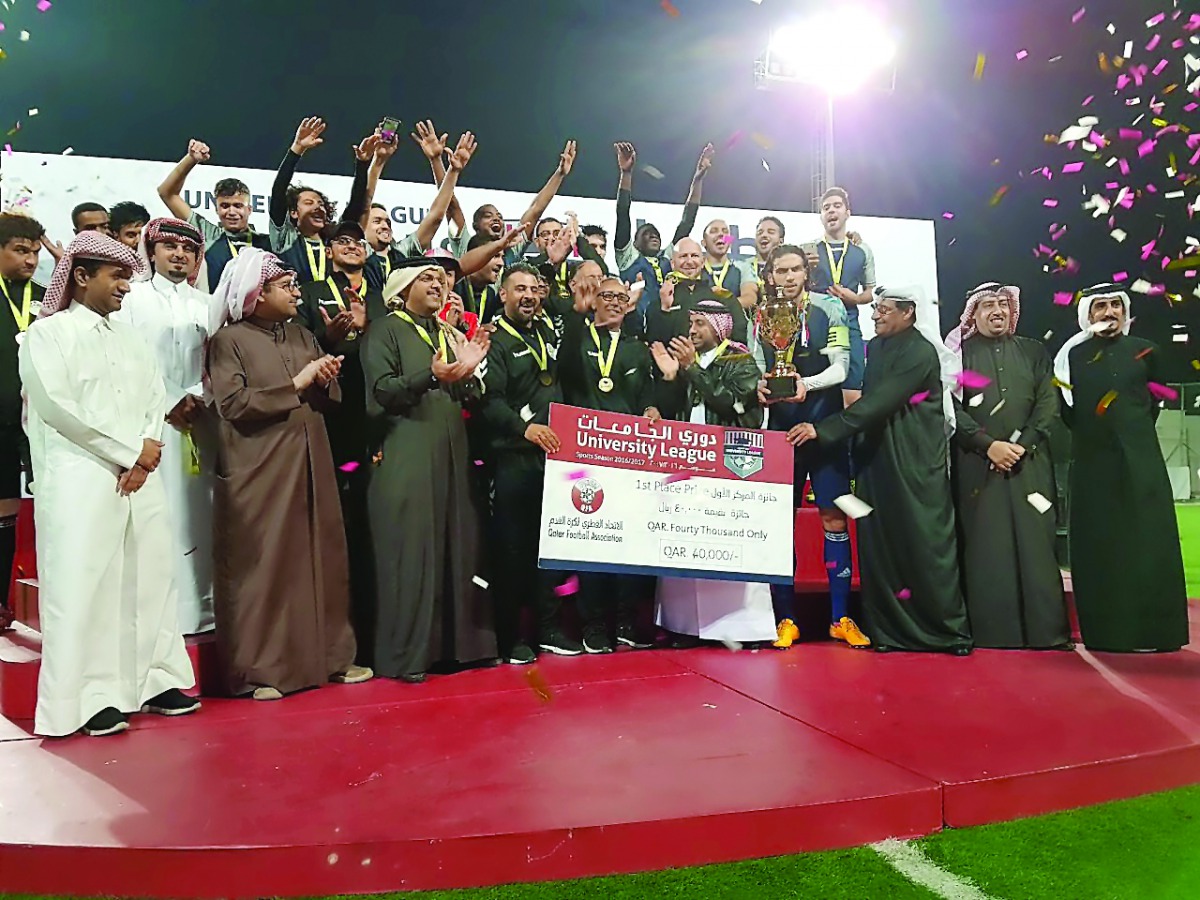 Qatar University players and team officials celebrate with tournament officials after they emerged University League football champions at Qatar Foundation’s Recreation Centre Pitch 1. Qatar University beat Qatar Aeronautical College 5-0 in a thrilling fi