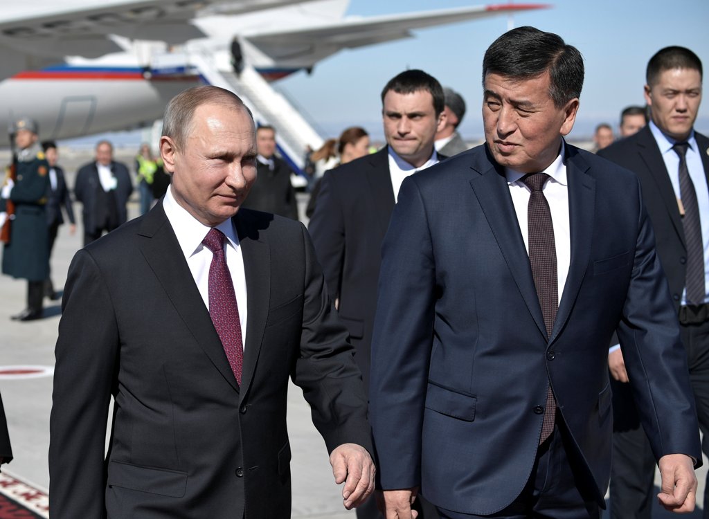Russia's President Vladimir Putin walks with Kyrgyz Prime Minister Sooronbai Zheenbekov upon his arrival at Manas airport outside Bishkek, Kyrgyzstan February 28, 2017. Sputnik/Alexei Nikolsky