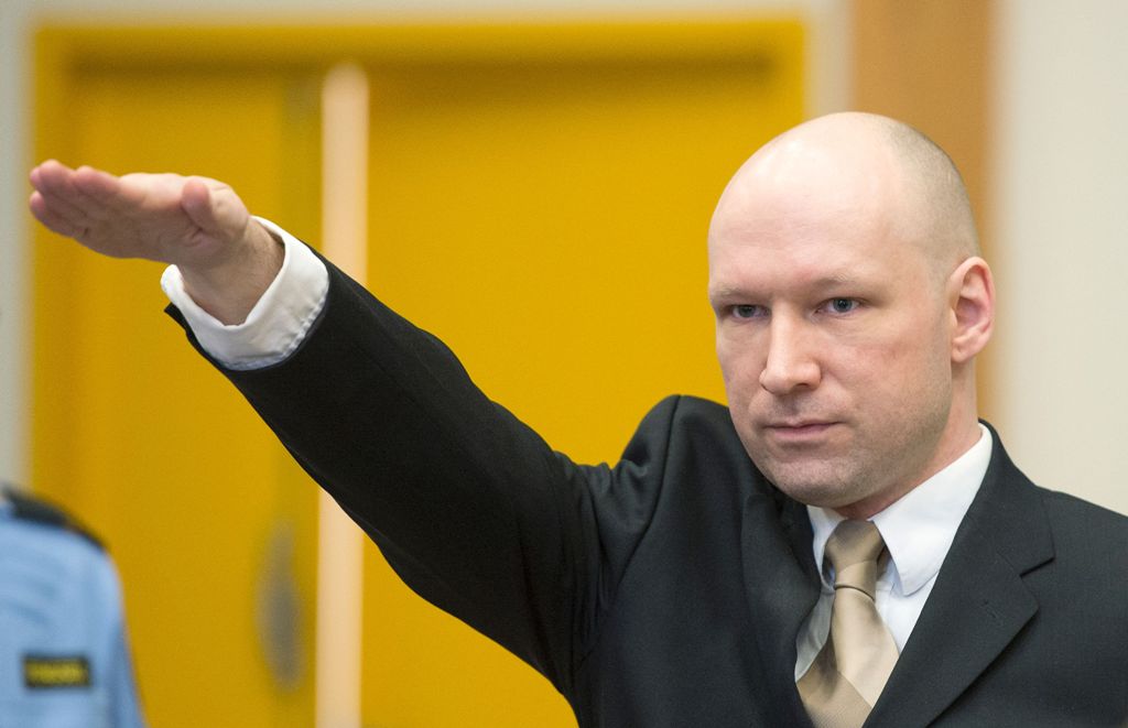 (FILES) This file photo taken on March 15, 2016 shows Norwegian mass killer Anders Behring Breivik making a Nazi salute as he arrives to a makeshift court in Skien prison's gym in Skien, some 130 km south west of Oslo, for his lawsuit against the Norwegia