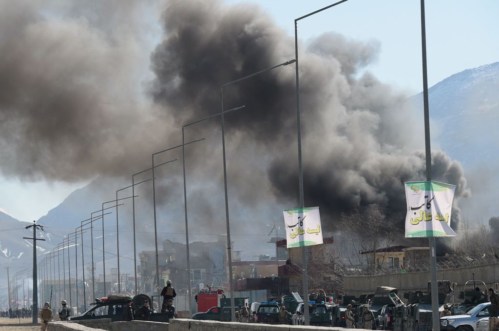 Smoke rises from an Afghan police district headquarters building after a suicide car bombing in Kabul on March 1, 2017.  AFP / SHAH MARAI