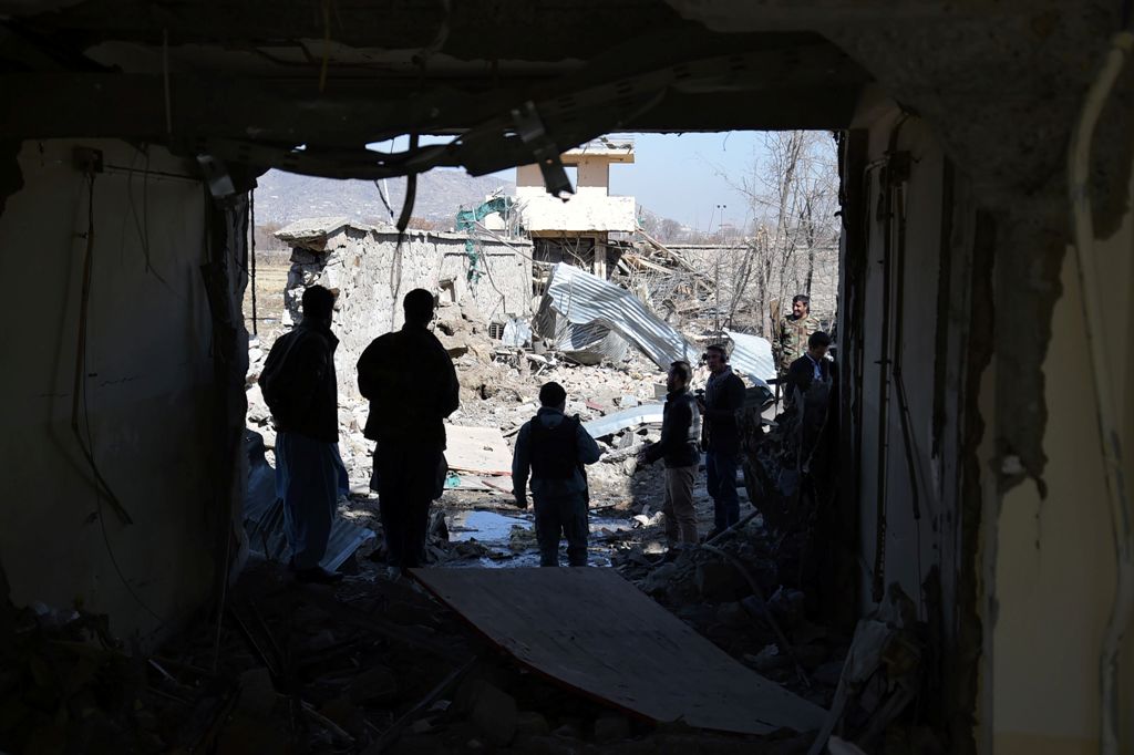 Afghan security forces investigate the wreckage of the district police headquarters in Kabul on March 2, 2017, a day after a suicide car bomb attack.  AFP / SHAH MARAI
