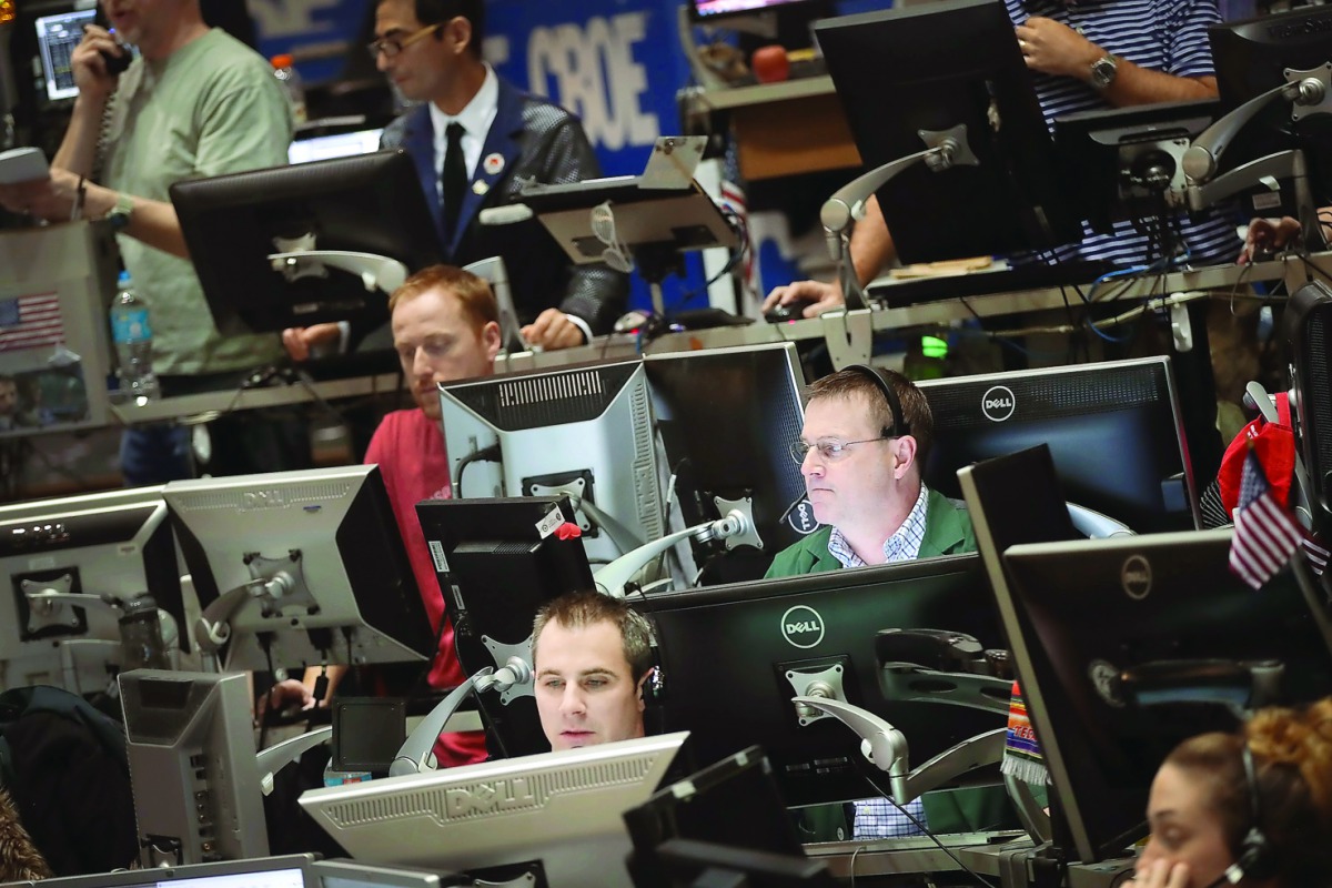 Traders in the Volatility Index (VIX) pit at the Chicago Board Options Exchange (CBOE) fill orders  in Chicago, Illinois. 