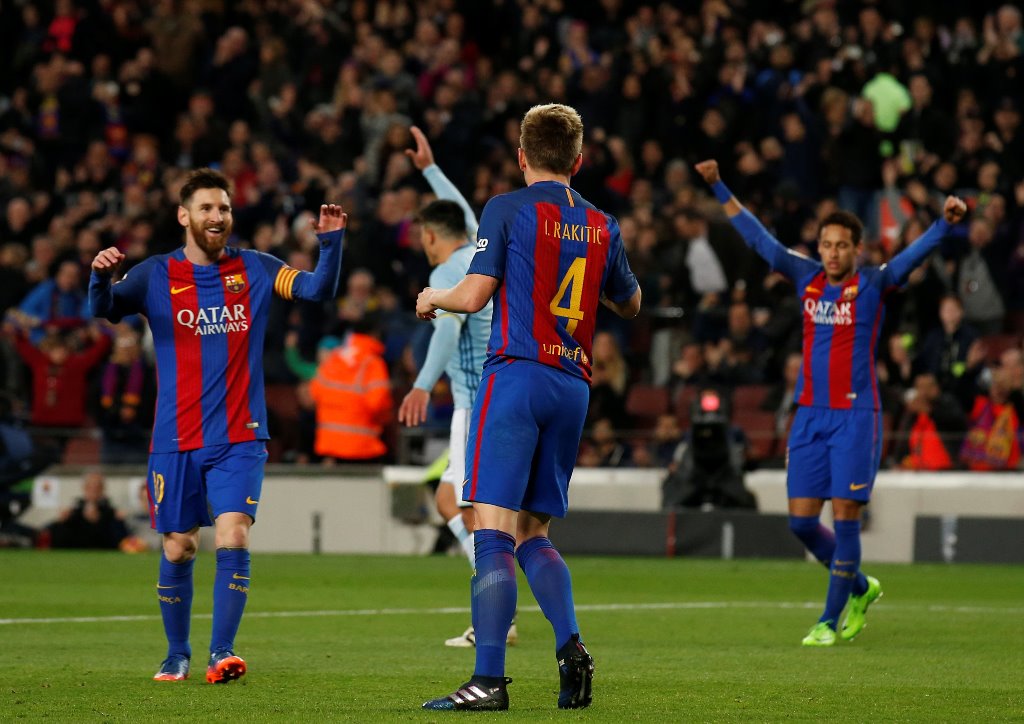 Barcelona's Lionel Messi, Ivan Rakitic and Neymar celebrate a goal. Reuters/Albert Gea