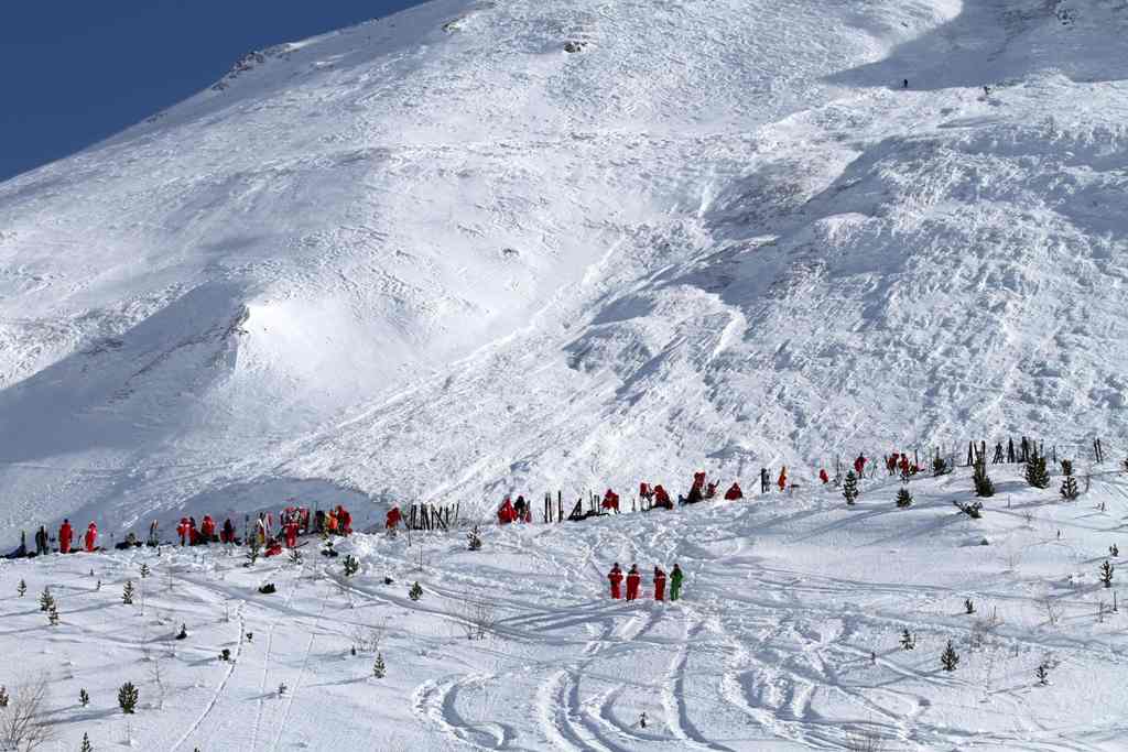 (FILES) This file handout photo taken and realeased on February 13, 2017 and made available by Radio Val d'Isere in Tignes, in the French Alps shows an avalanche site in an off-piste area after an avalanche engulfed nine people, killing at least four.  AF