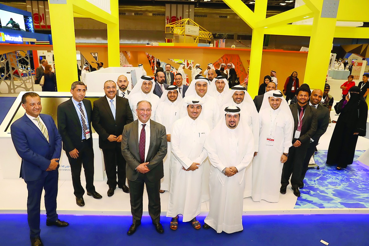 Mwani Qatar officials at the QITCOM exhibition and conference.