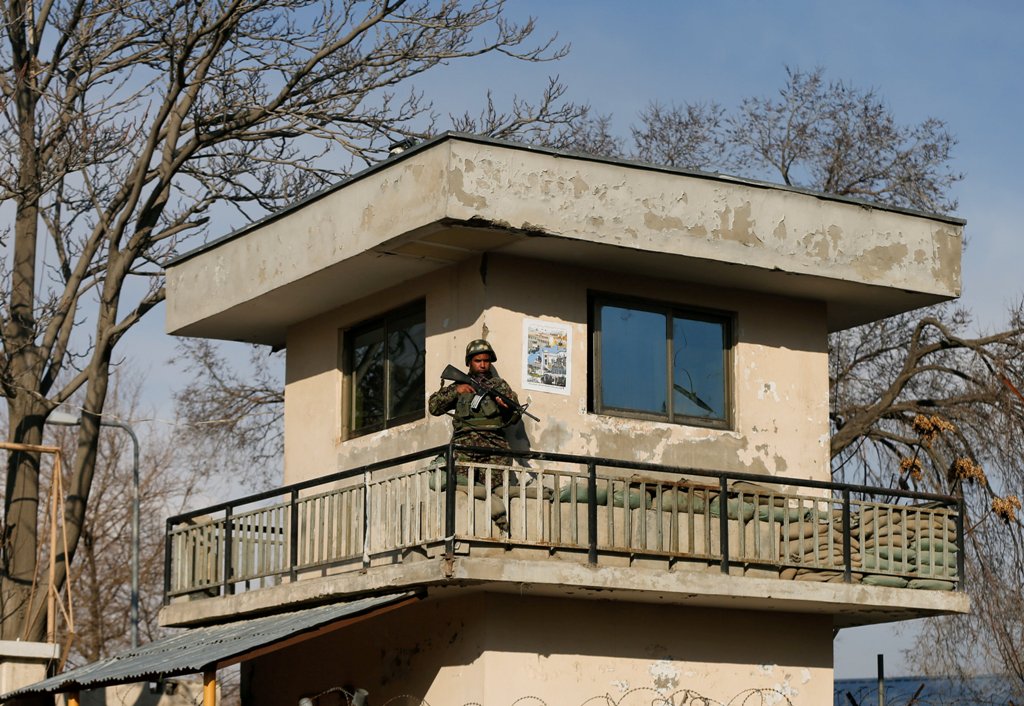 An Afghan security force member stands guard near a military hospital at the site of blast and gunfire in Kabul, Afghanistan March 8, 2017. REUTERS/Mohammad Ismail