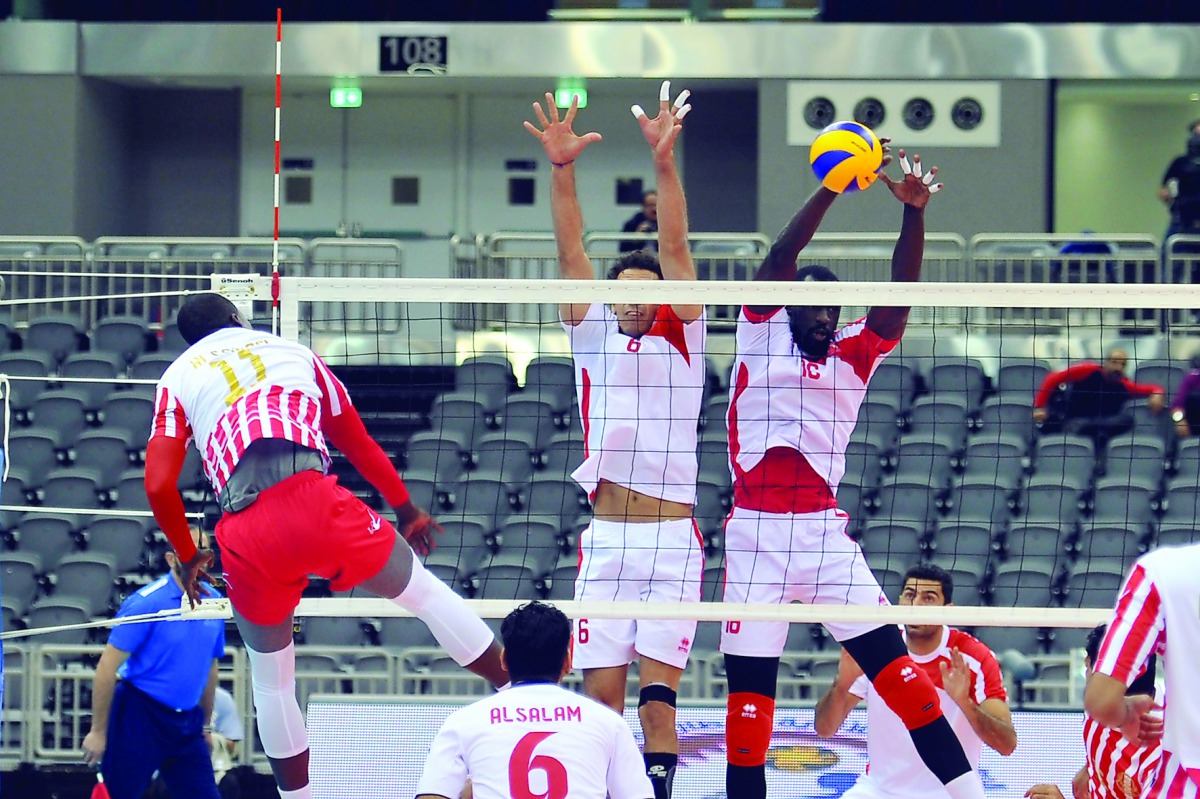 A player from Al Salam attacks as Qatar's Al Arabi players try to bock the same during their GCC Clubs Championship volleyball match played at Ali bin Hamad Al Attiyah Arena yesterday. Picture by Kammutty VP/The Peninsula
