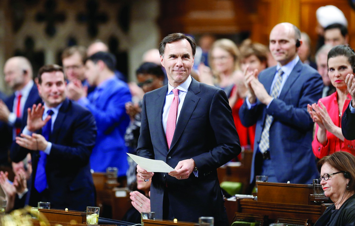Canada's Finance Minister Bill Morneau receives a standing ovation while announcing the date of the federal budget during Question Period in the House of Commons on Parliament Hill in Ottawa, Ontario, Canada.